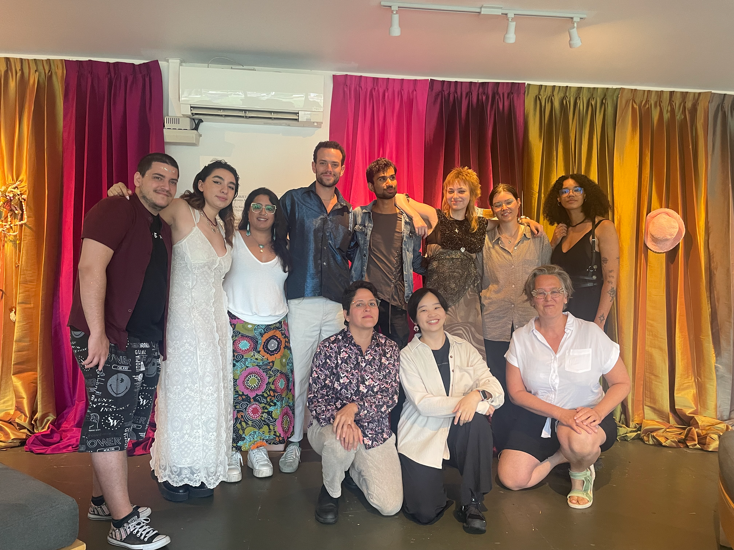 Group of 10 selected OCAD University students and arts duo Tony Macarena at their Pride Toronto exhibition, held at Stackt Market