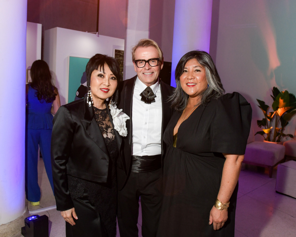 From left to right: Susan Langdon, Glenn Dixon, and Ana Serrano, President and Vice-Chancellor of OCAD University, standing together at the OCAD U Gala in formal attire.