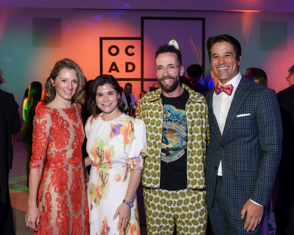 From left to right: Mila Cormack, Emily Thring, Alan Gertner and David Tran, standing together at the OCAD U Gala in colourful formal attire.