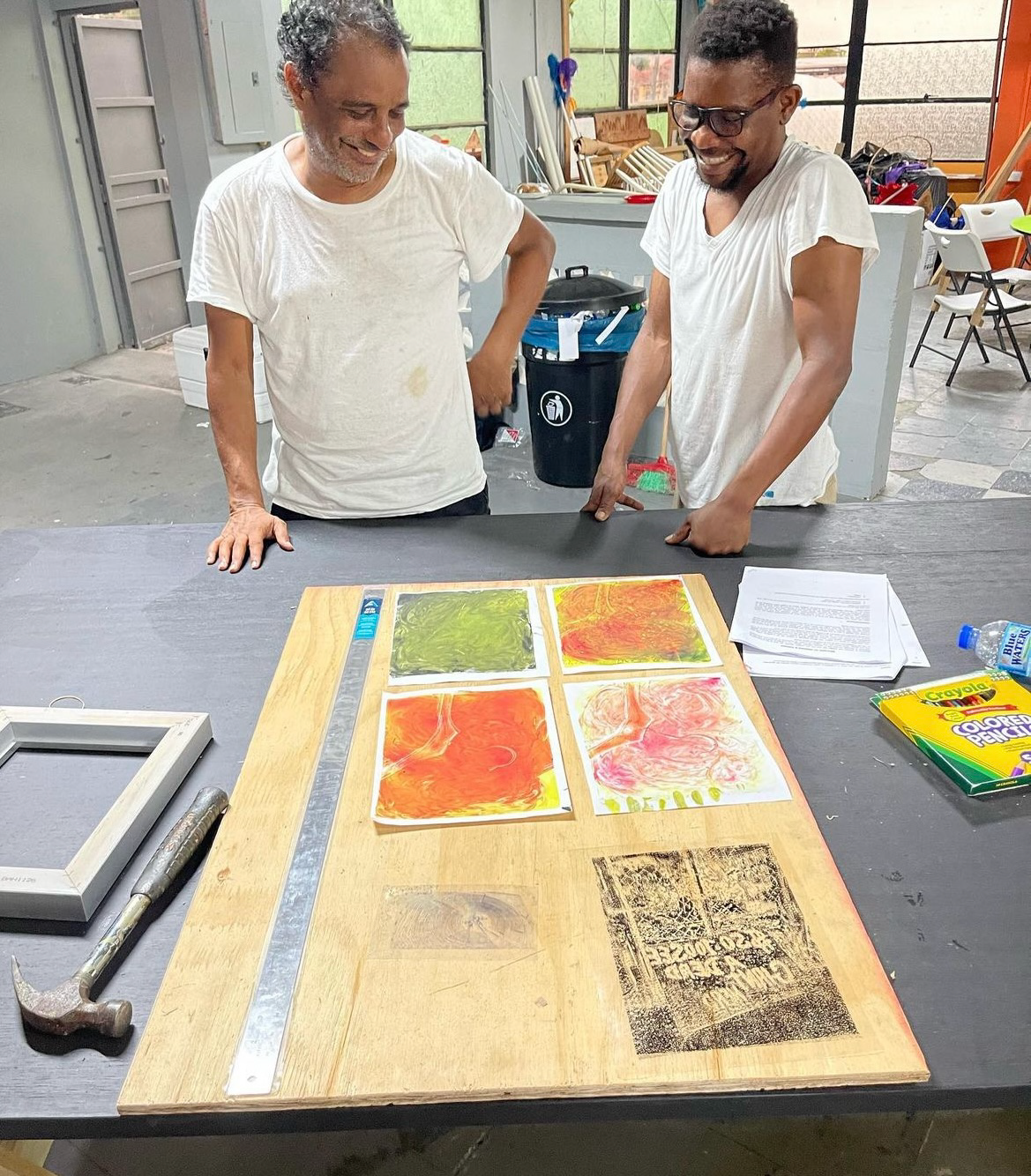 Artist Christopher Cozier and Prof. Esery Mondesir at Alice Yard, Trinidad.