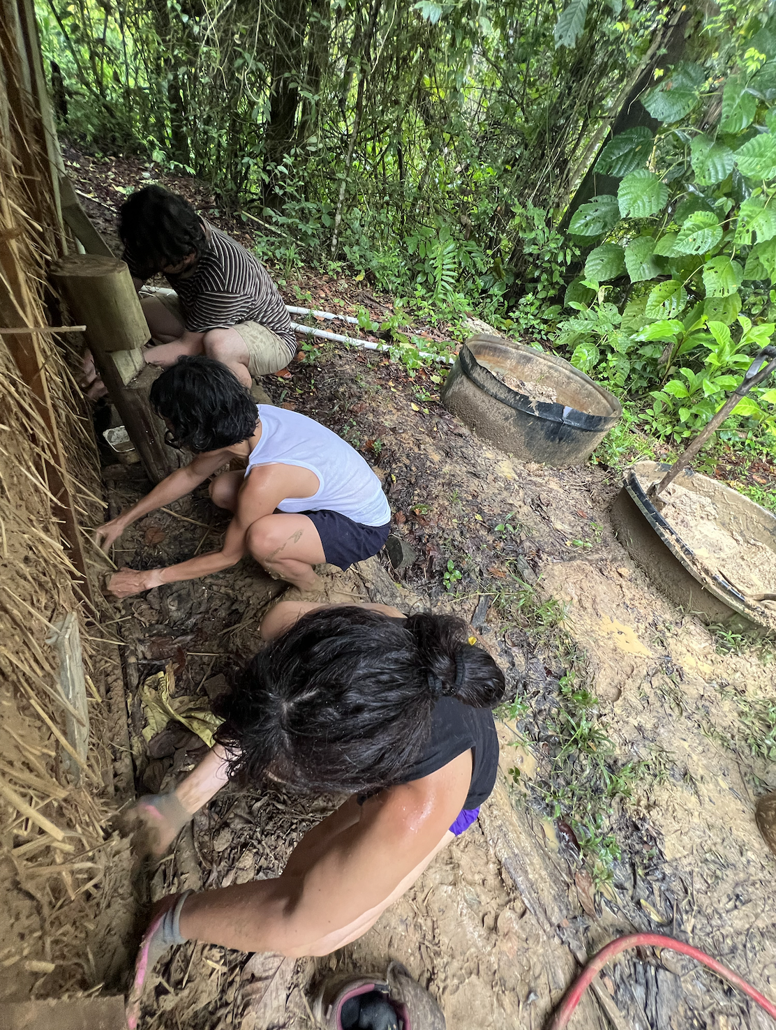 Students leveling ground for natural building structure