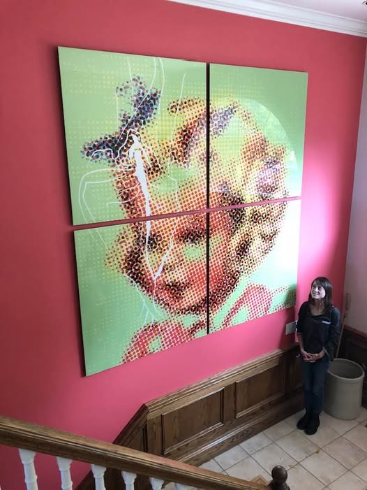 Piper standing next to artwork