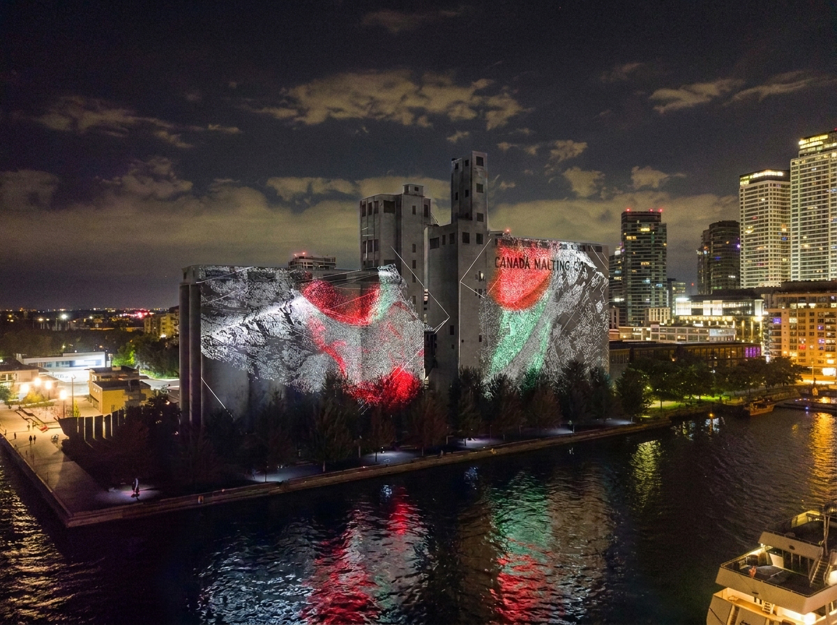 Malting Silos light up with a projection of red, white and green image