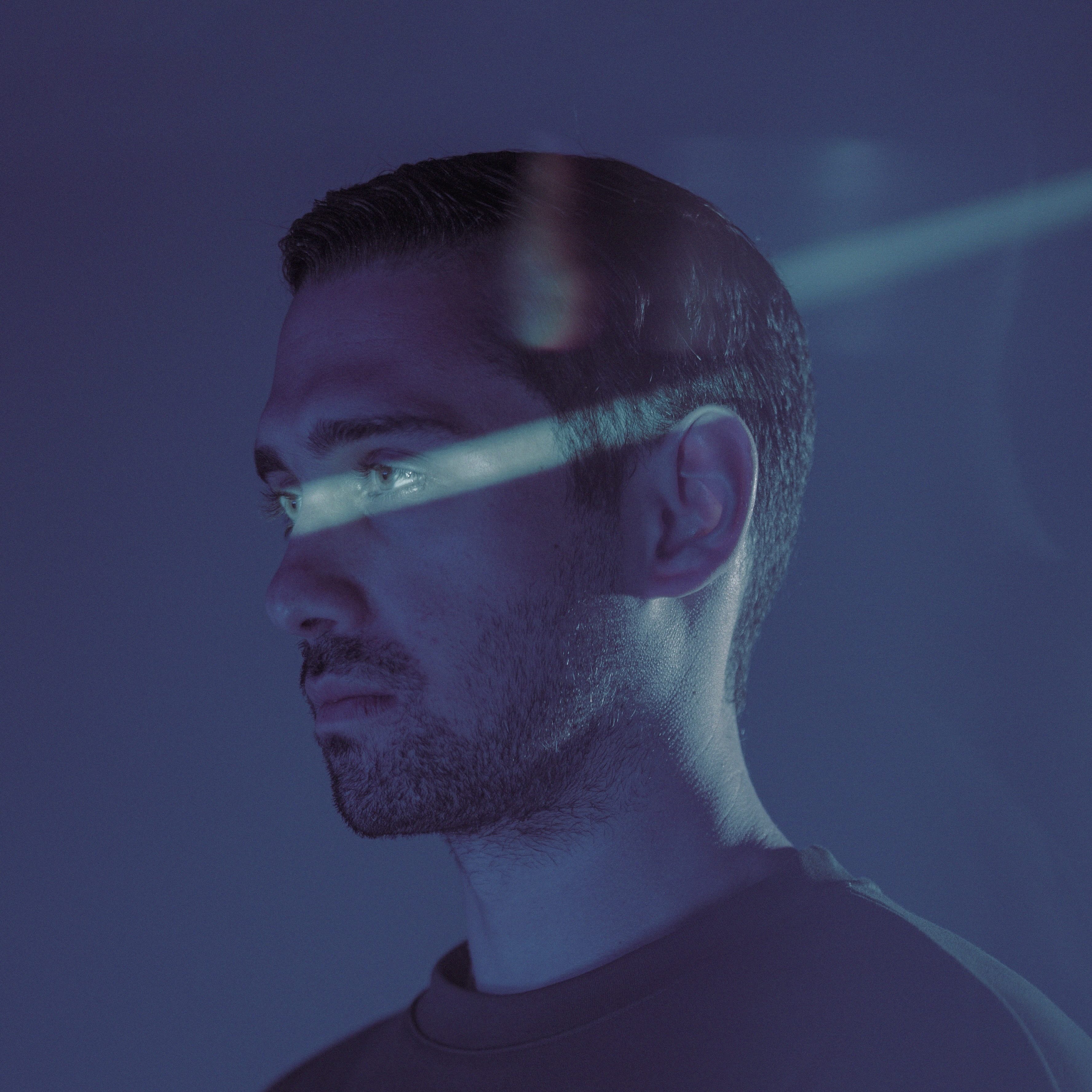 Photo of man against a dark background