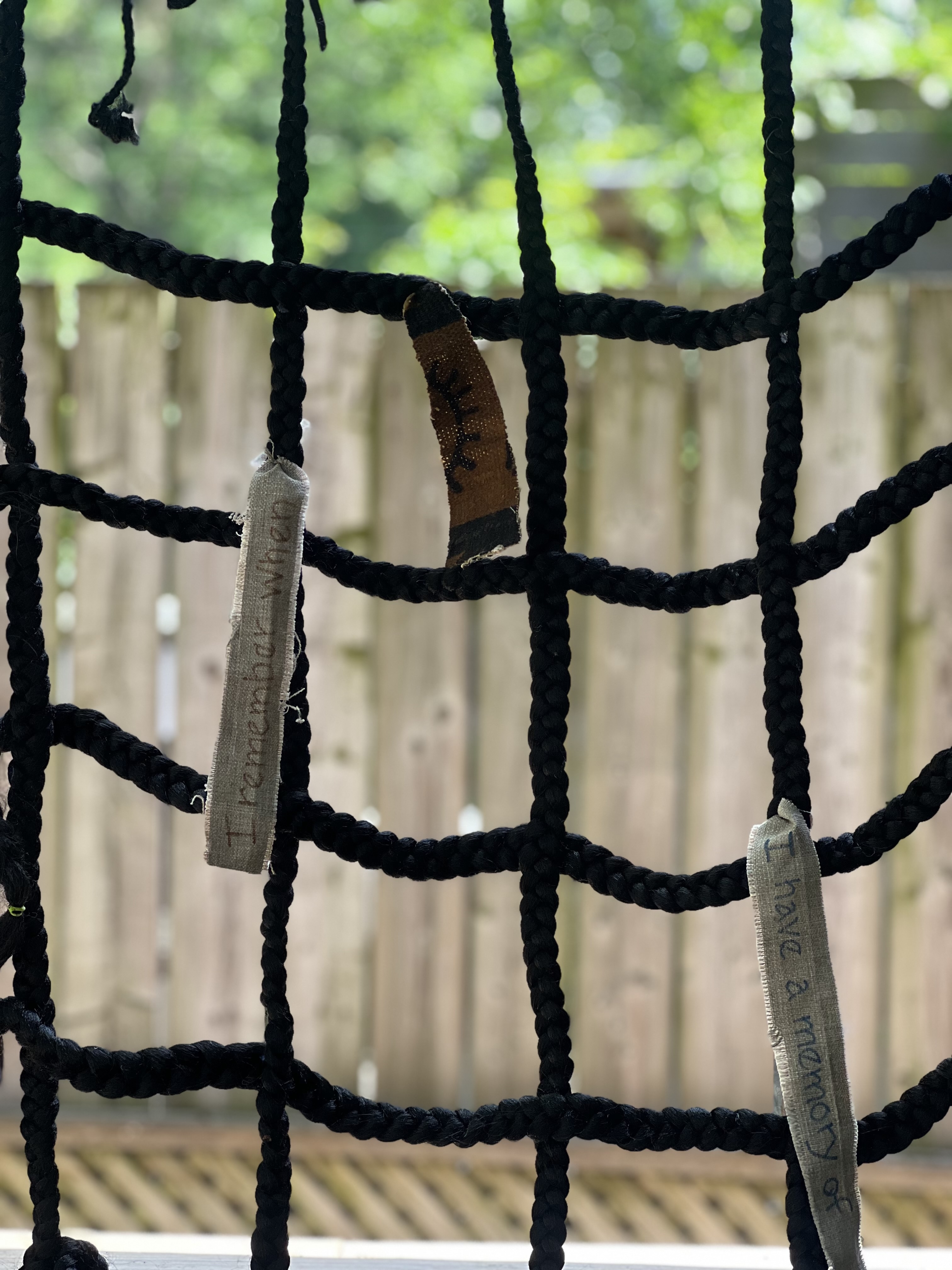 Intertwined rope with hanging signs