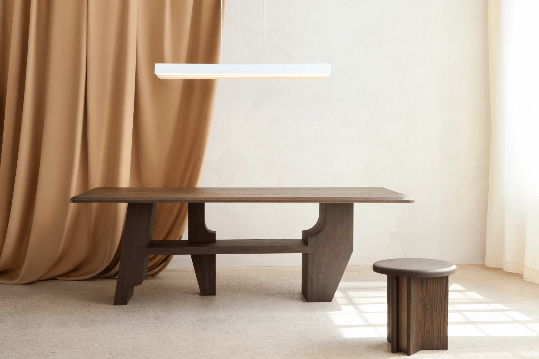 Photograph of the Knox Dining Table and the Viggo Side Table from the 2025 Joue collection