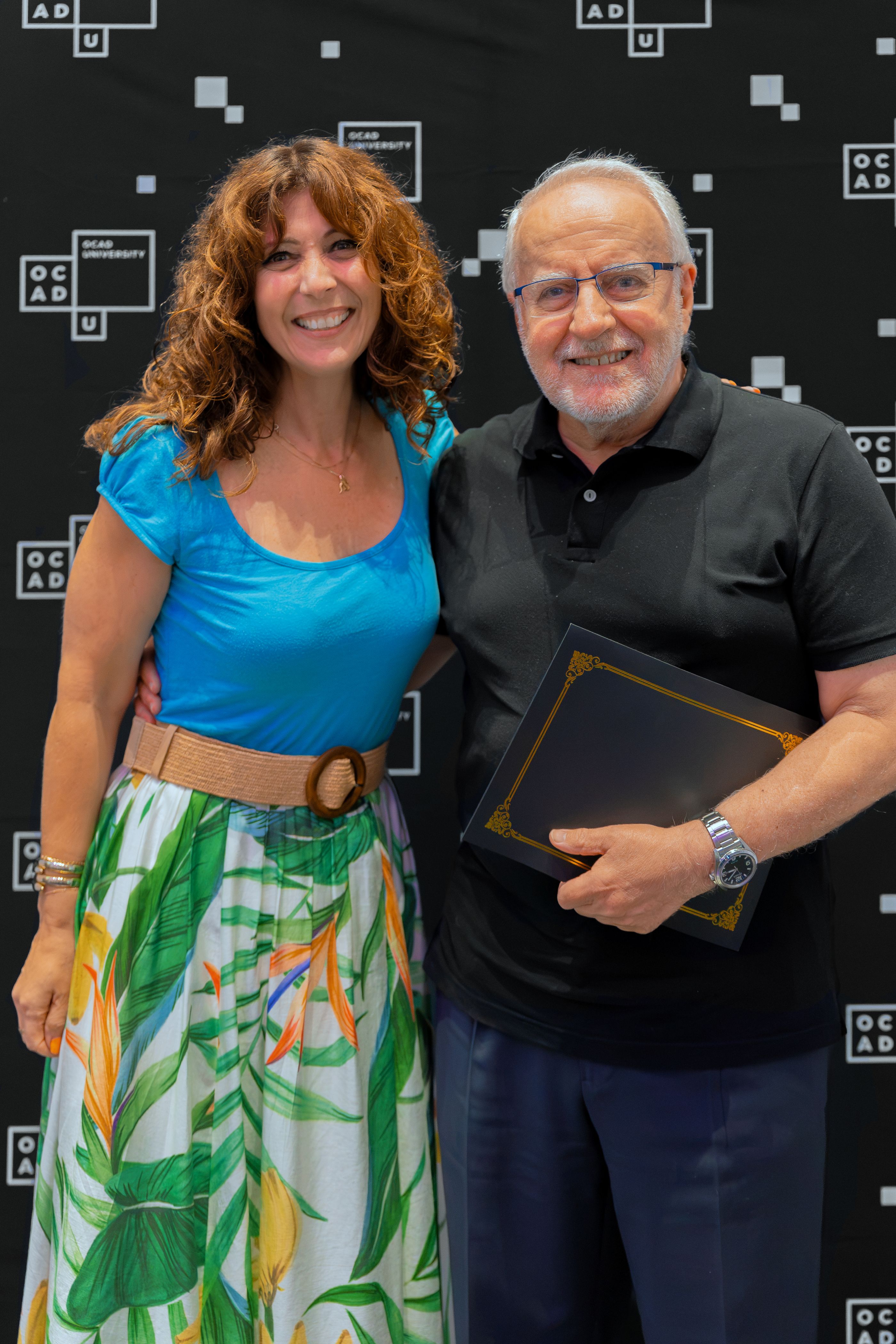 left to right: Dr. Gabriele, wearing a blue top and green and white skirt; and Dr. Harfoush wearing black top and navy pants.