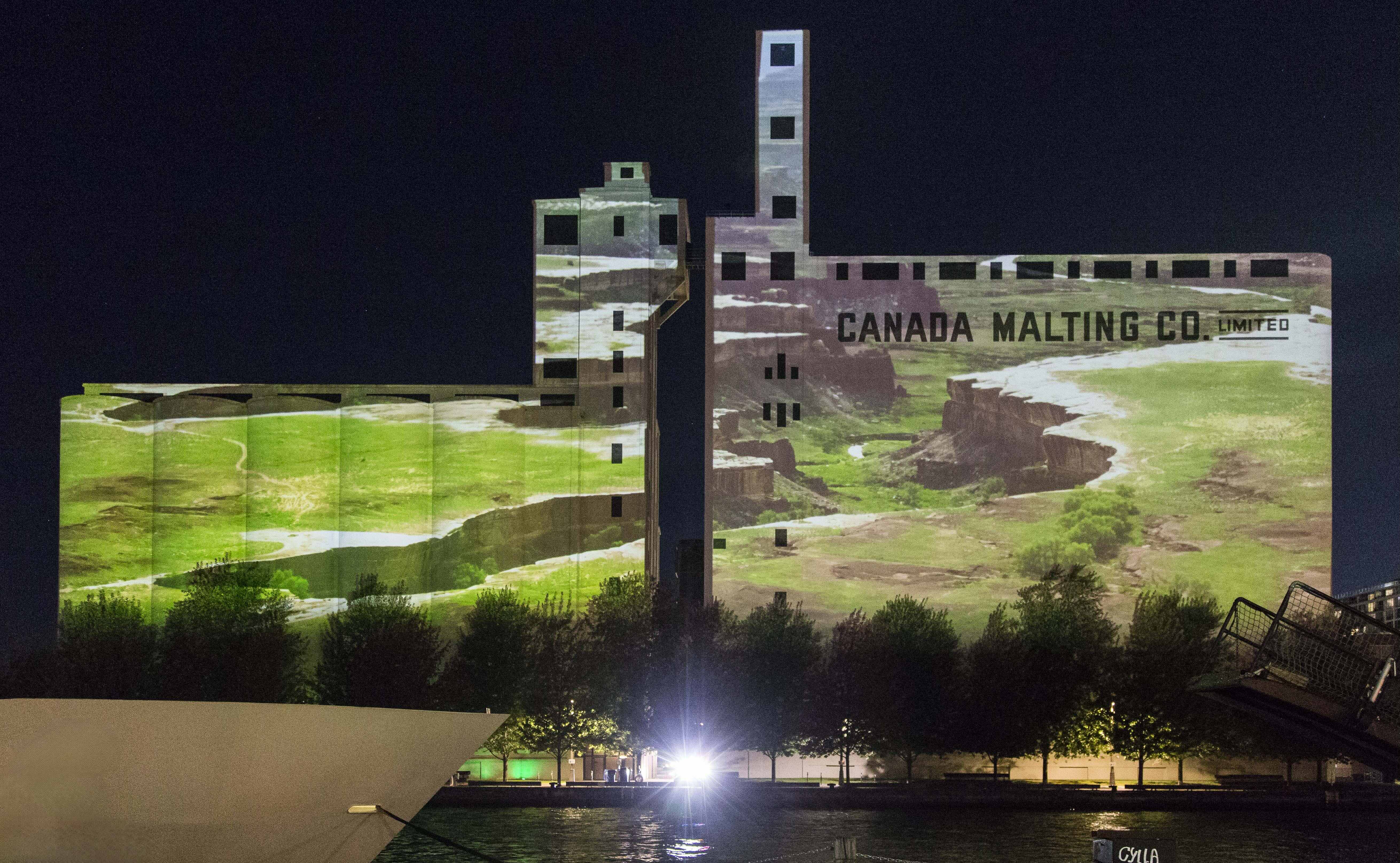 Projection of green landscape on Canada Malting Silos