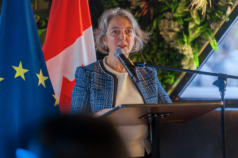 Government of Canada’s Environment and Climate Change Minister Julie Dabrusin at podium, wearing a blue jacket and white top. 
