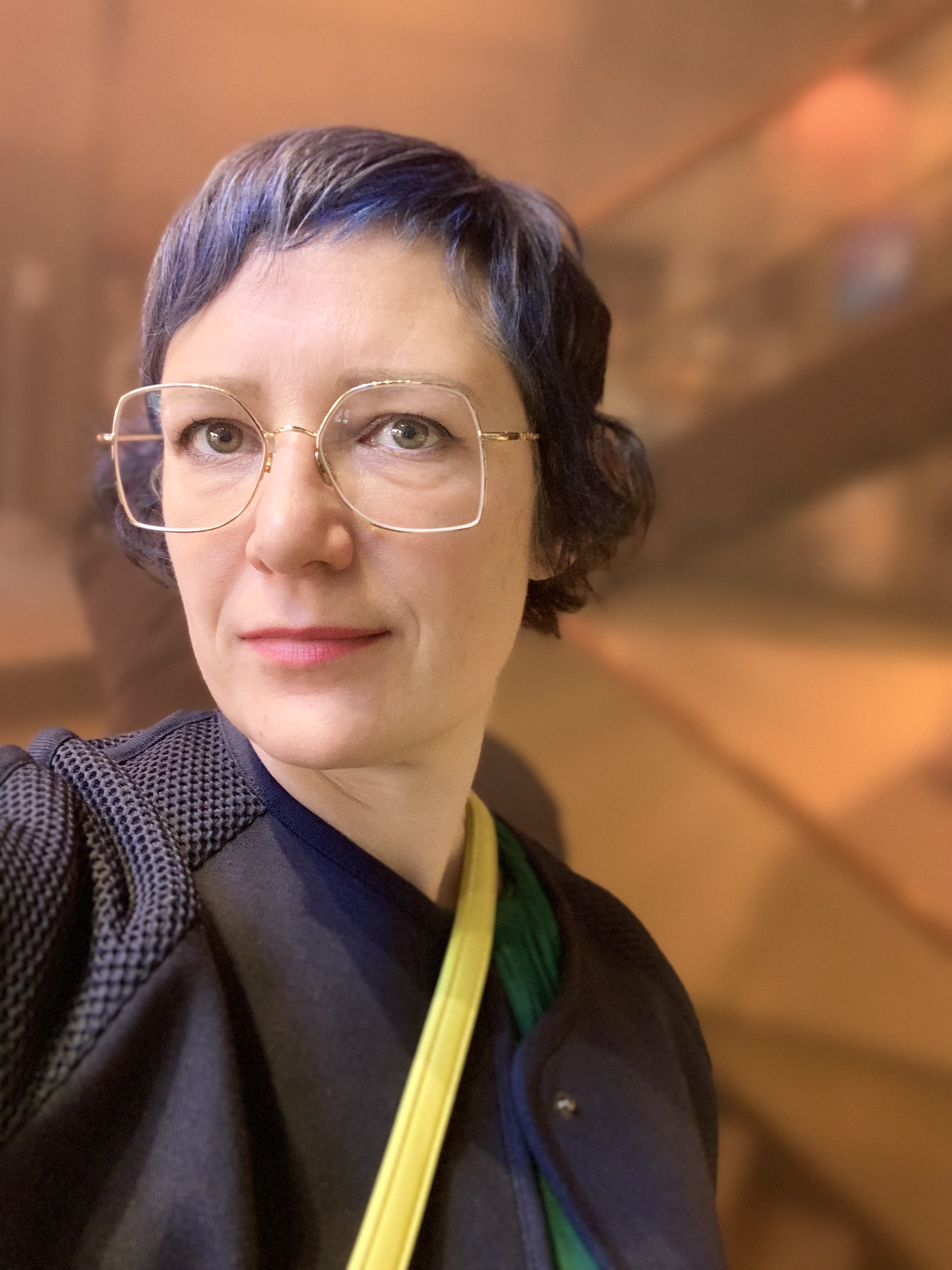 Photo of woman with short hair and glasses 
