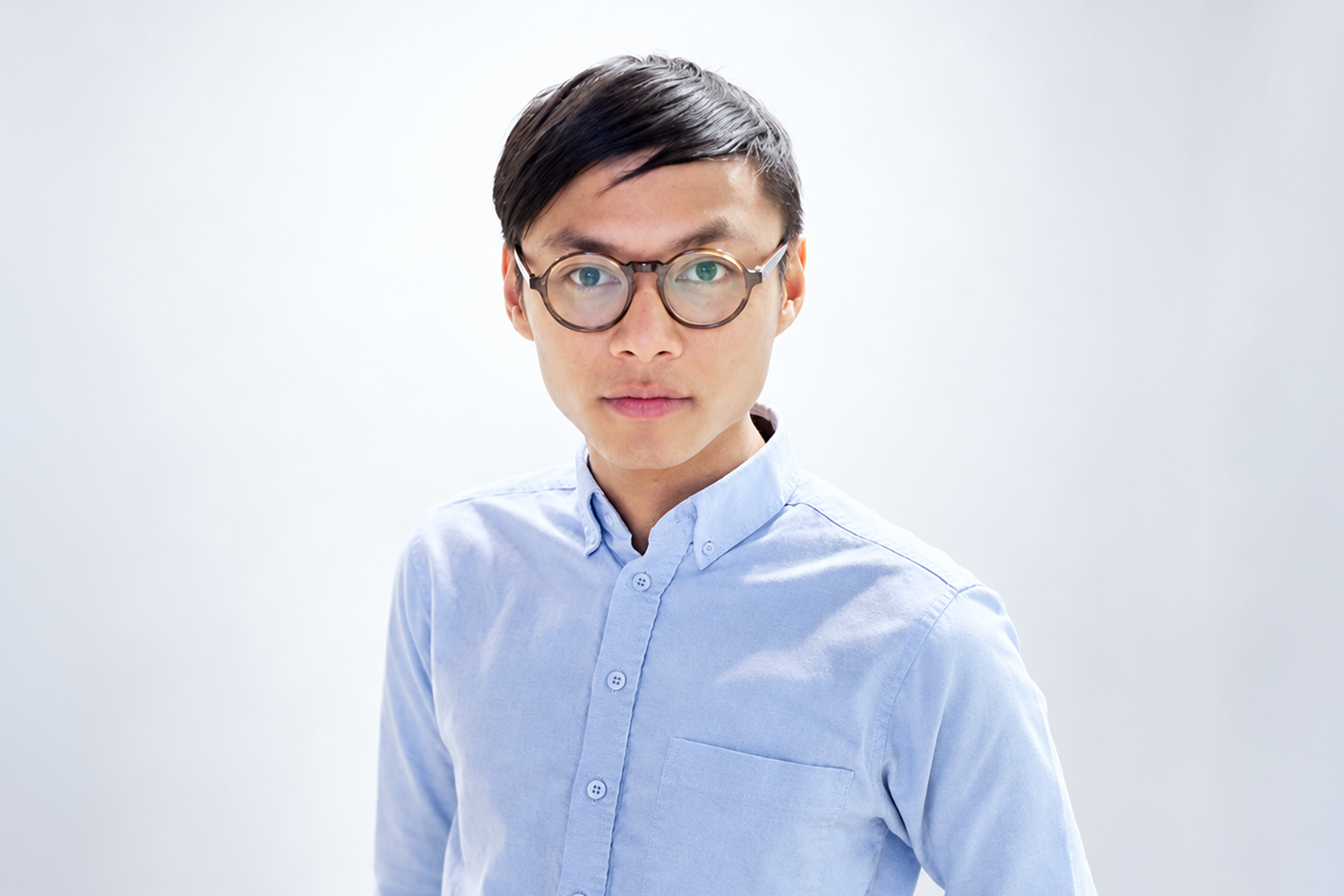 Man wearing glasses and blue shirt