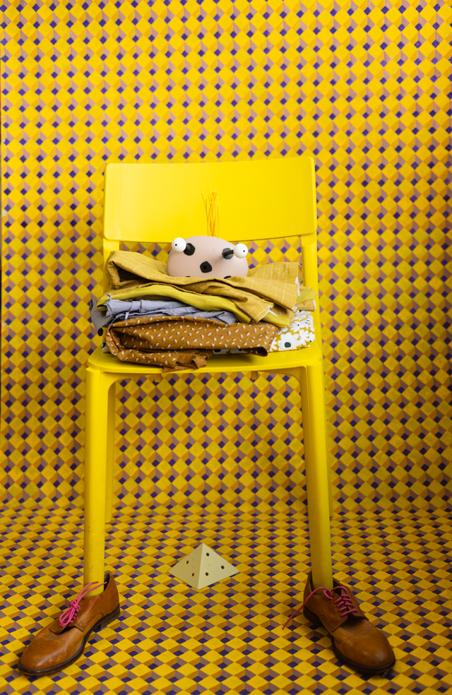 Artwork by Michelle Forsyth, yellow chair, brown shoes and yellow background
