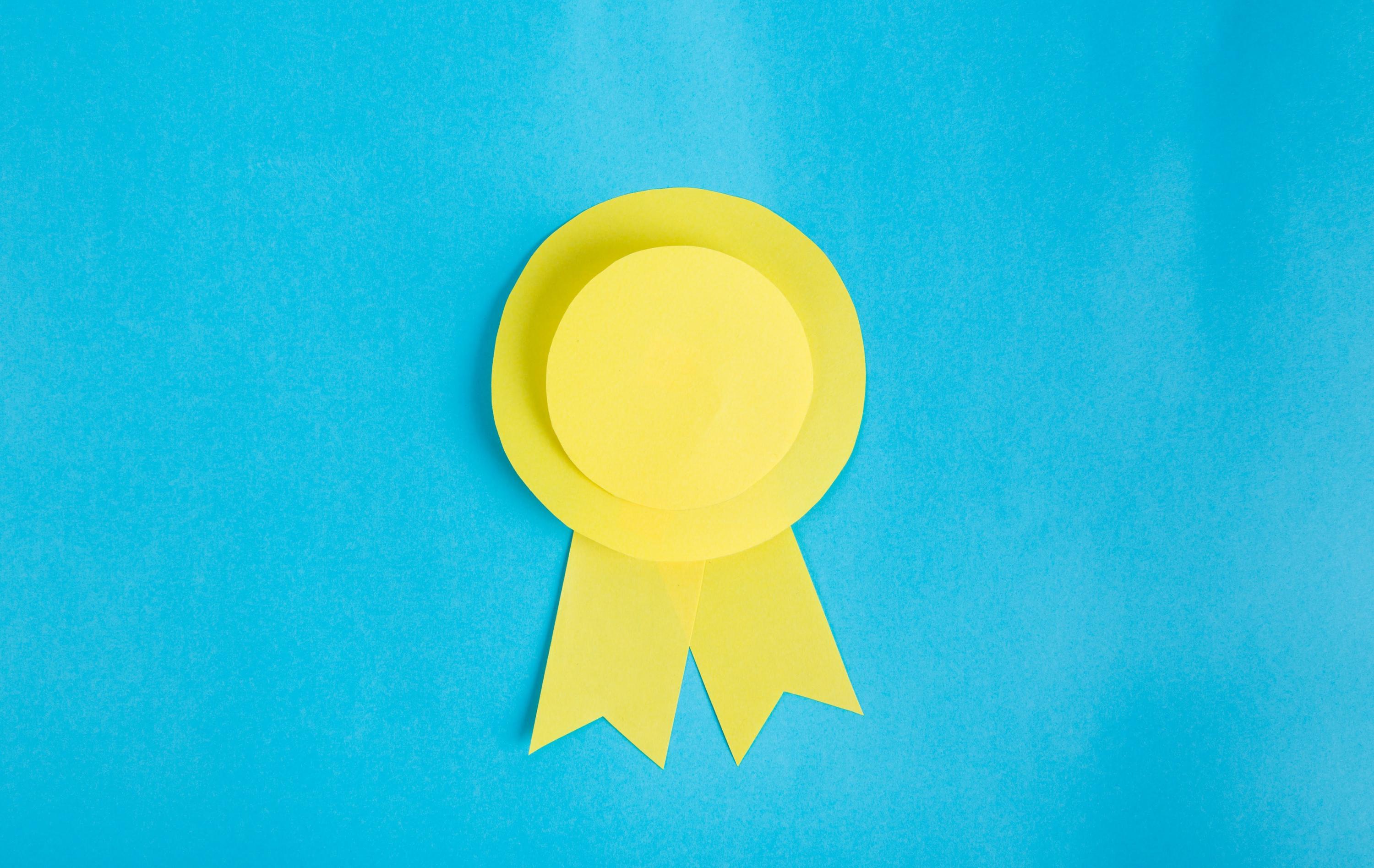 A yellow ribbon on a blue background.