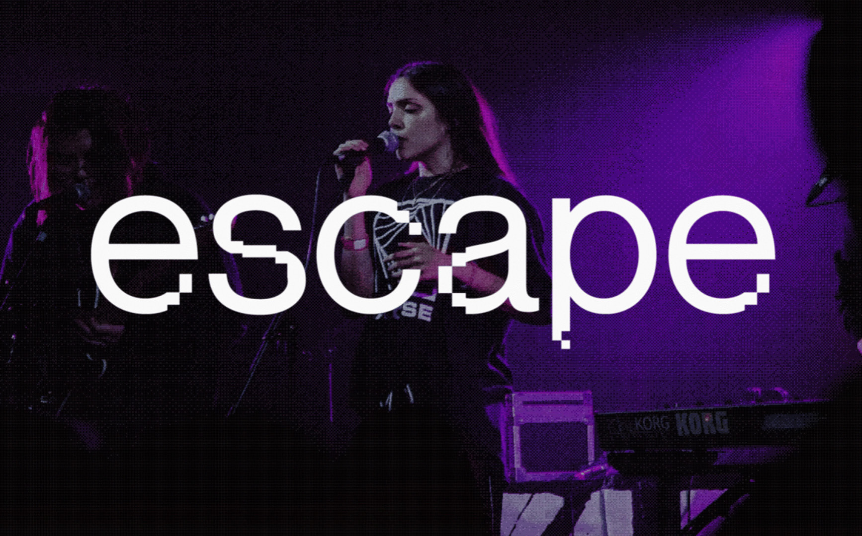 A woman holding a microphone performs in a dark music venue with moody purple lighting. The word Escape is overlaid on the photograph.