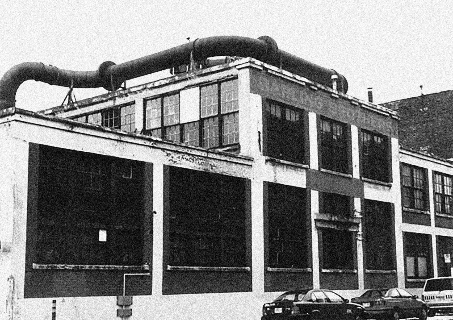 A black and white archival photo of an industrial building