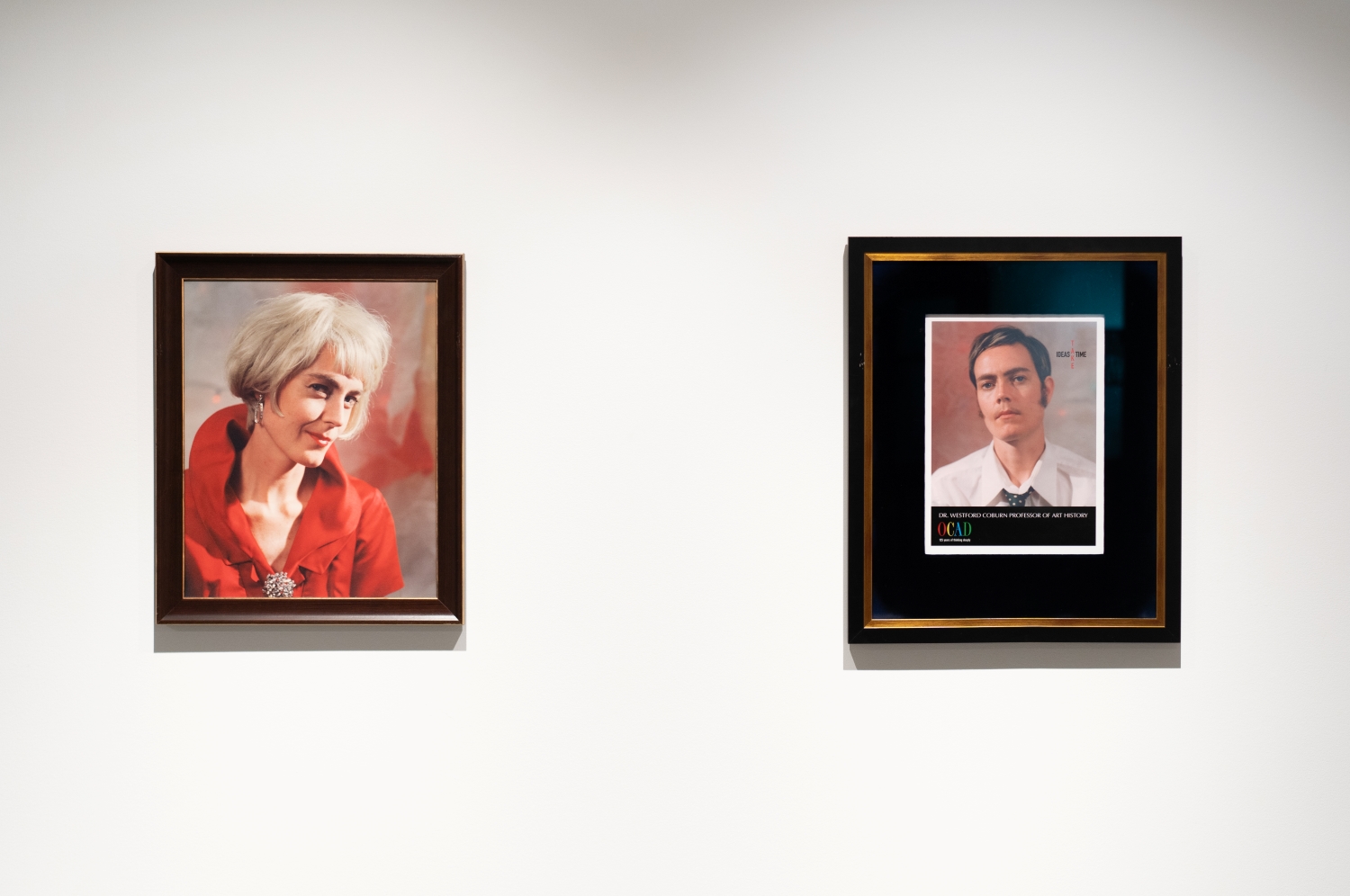 Installation view: Wendy Coburn Fable for Tomorrow, left photograph is a person with blonde hair and red shirt, right photograph, the left photograph is of a person with short brown hair, wearing a white shirt and tie.