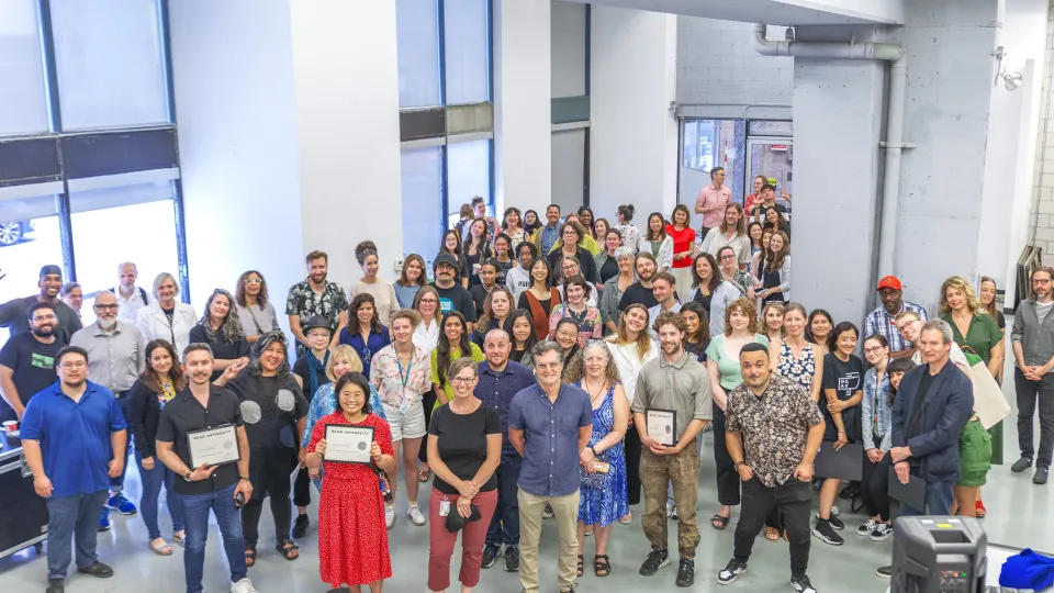 Large group of people in the lobby of an OCAD building