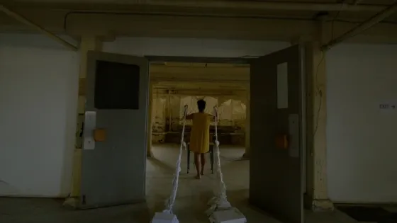 A person standing in a doorway