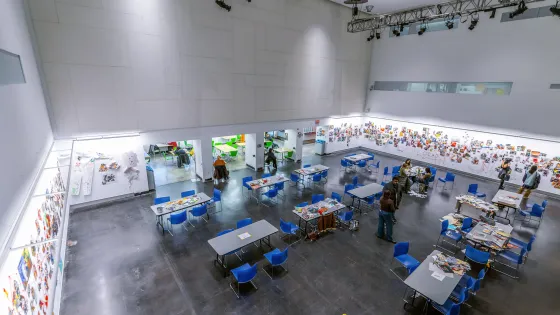 Top down view of the Great Hall with tables and students working at them