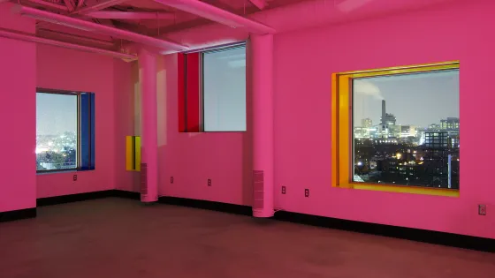 Interior of the Sharp Center, with walls drenched in pink lights