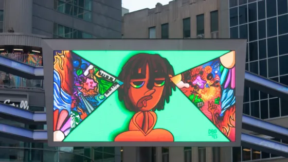 Screen at Sankofa Square displaying artwork by Dose Omoruna.