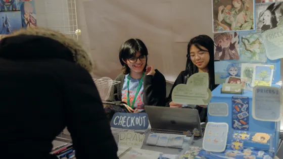 fiawerss and UWAHCHI at their OCAD U supported table at Mutual Artist Network’s CREΔTIA Market.