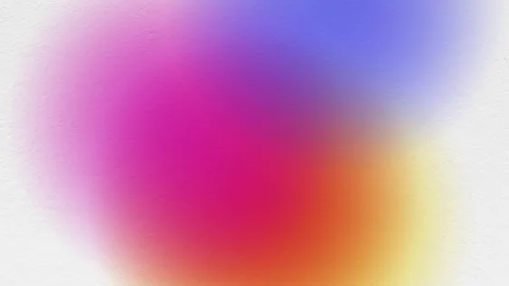 White background with faded pink, blue, orange and yellow circles overlapping in the center foreground.