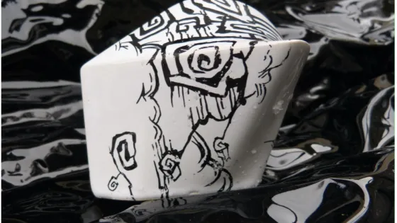 Black and white image of a drawing on a sculpture