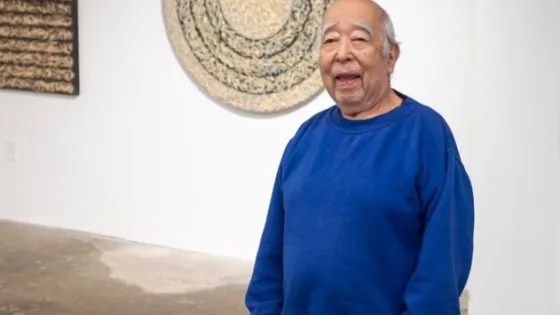 Nobuo Kubota wearing a blue sweater. 