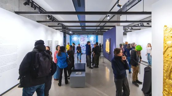 Visitors admire artworks at Onsite Gallery