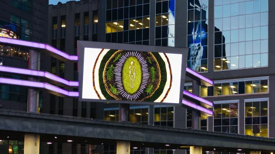 Digital screen at Sankofa Square displaying artwork by Jordyn Hendricks.