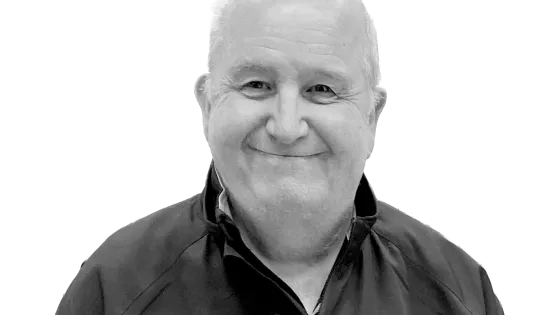 Bald man smiling wearing shirt with zipper