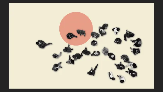 overhead shot of people walking on a light yellow ground with an orange pattern.