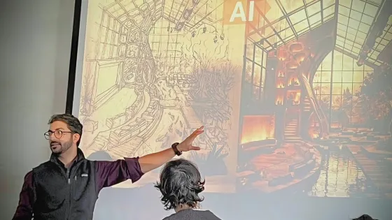 Professor pointing to a screen of two images