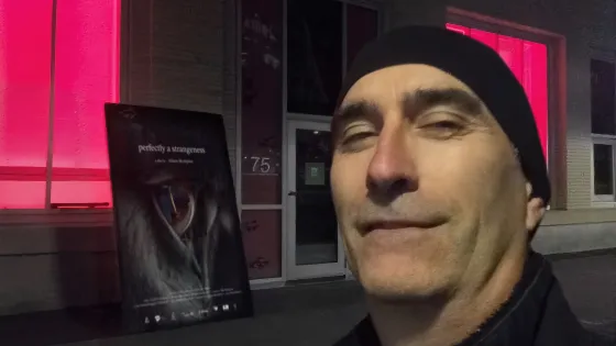 Photo of Charles Marchand wearing a black hat.