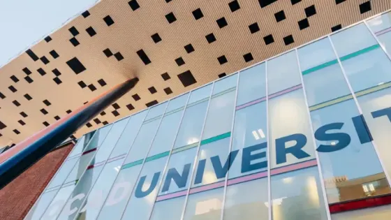 Image of OCAD U tabletop with glass windows showing the word, University