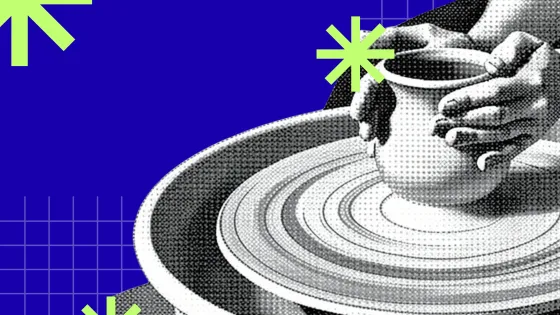 A potter throwing a pot on the pottery wheel