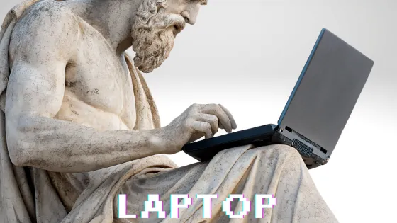 A marble statue using a laptop