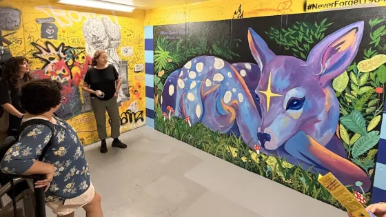 Mural of a fawn in yellow staircase