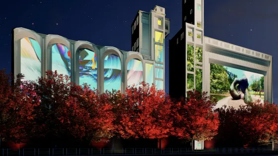 Artwork projected on Canada Malting Silos, with red trees in foreground
