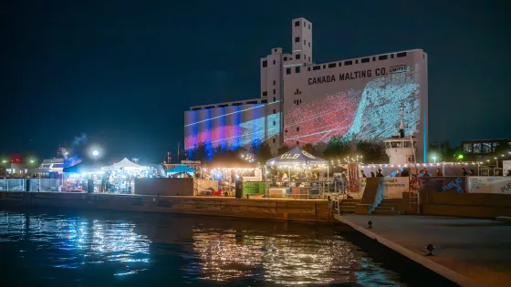 SILO NIGHTS at night as part of Public Pier, waterfront, Canada Malting Silos in background
