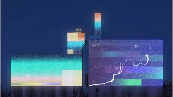 Art projected on the side of a large building at night