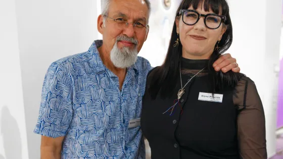 A man posing with a woman