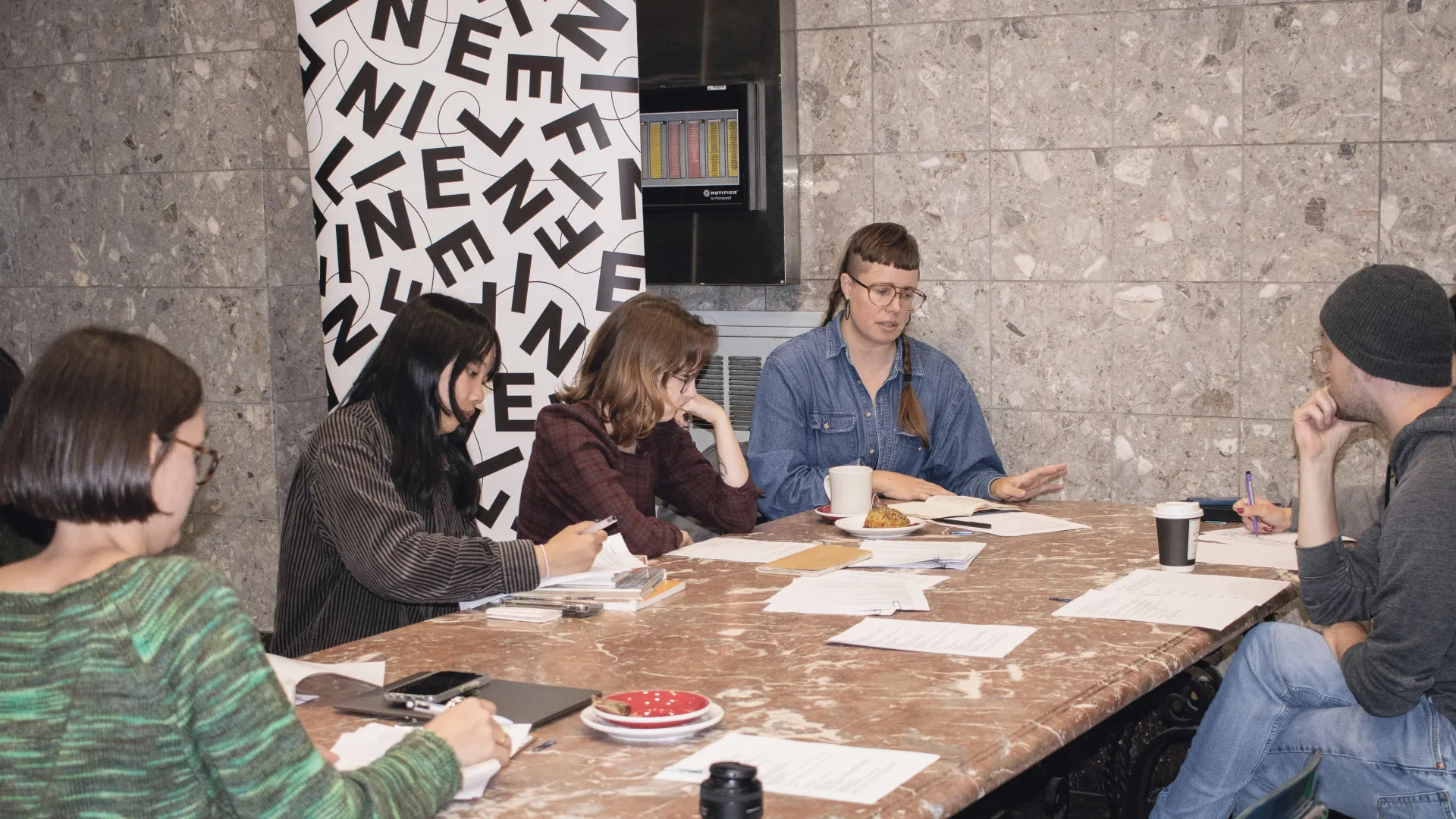 Group of people sitting around a table co-working