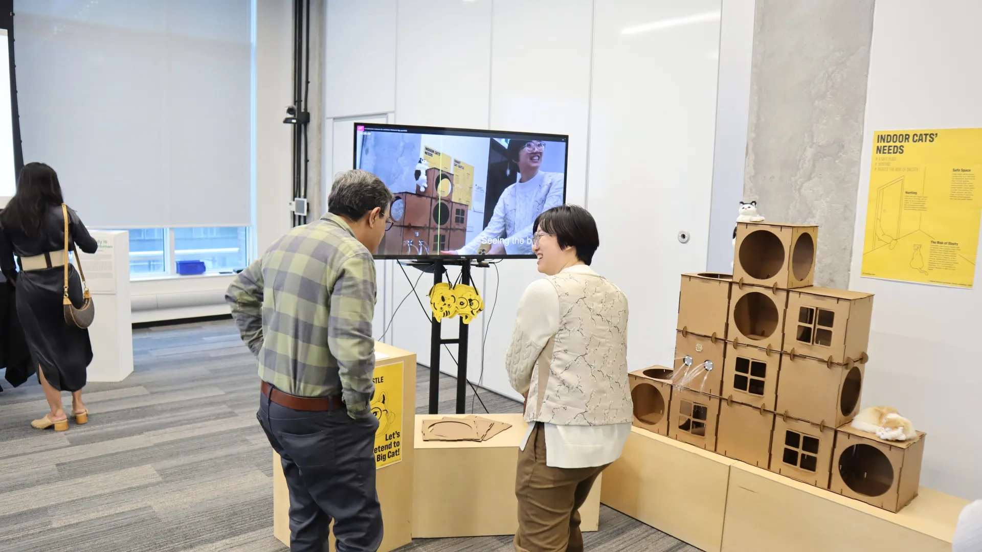 Two people looking at an art installation