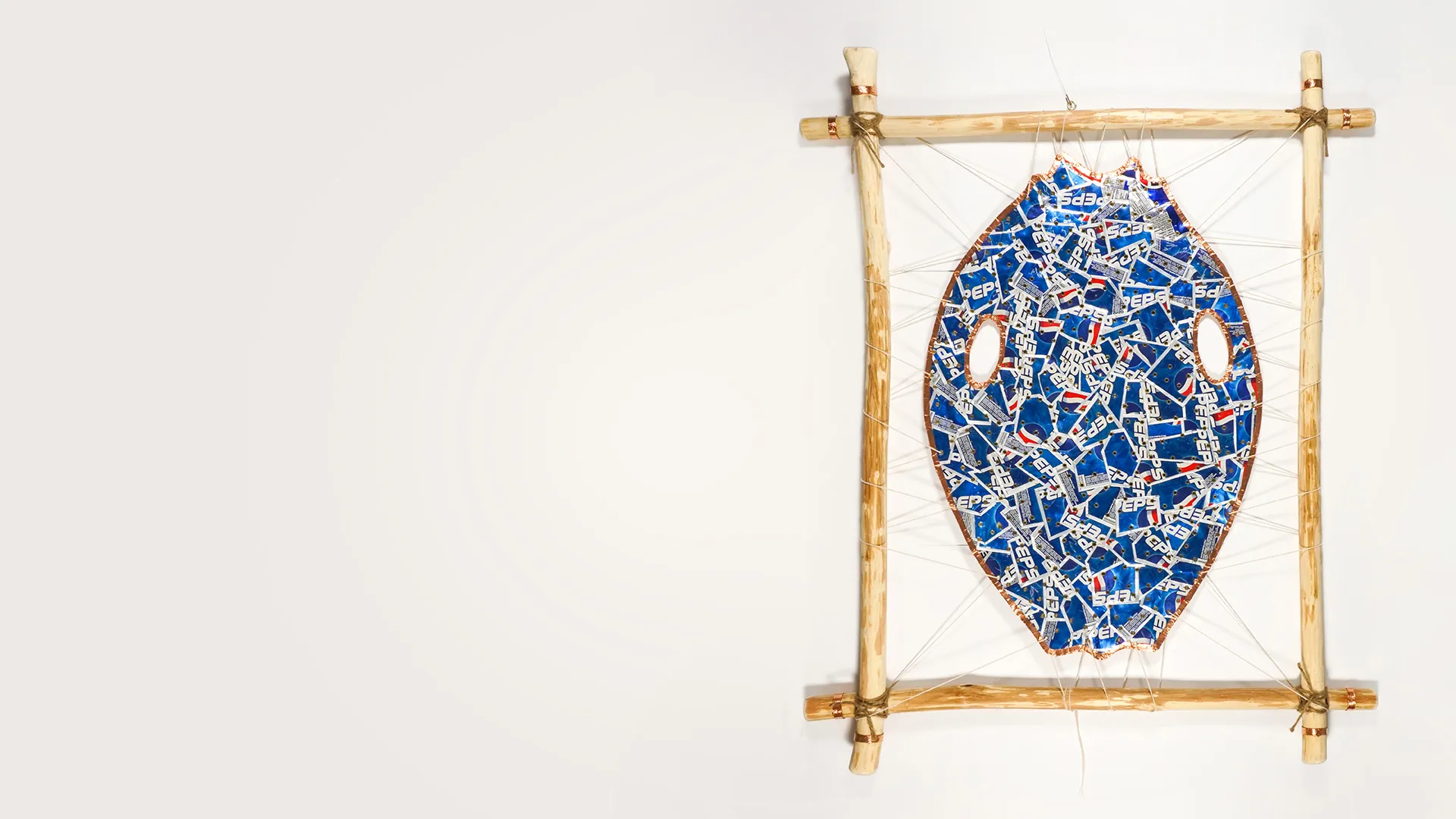 Michael Massie, “pop” art in suspension, 2025, aluminum, wood, copper, string/gut. Image courtesy of Fehely Fine Arts, photo by Renzo Fernandez.