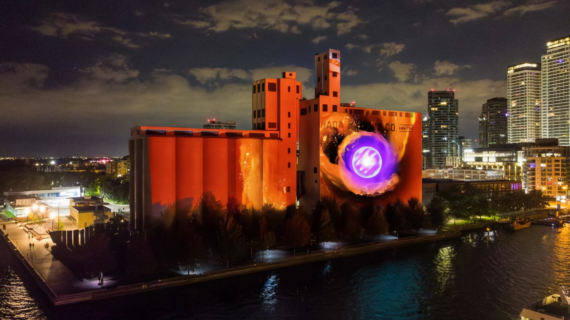 Artwork project on Canada Malting Silos, orange with a purple circle