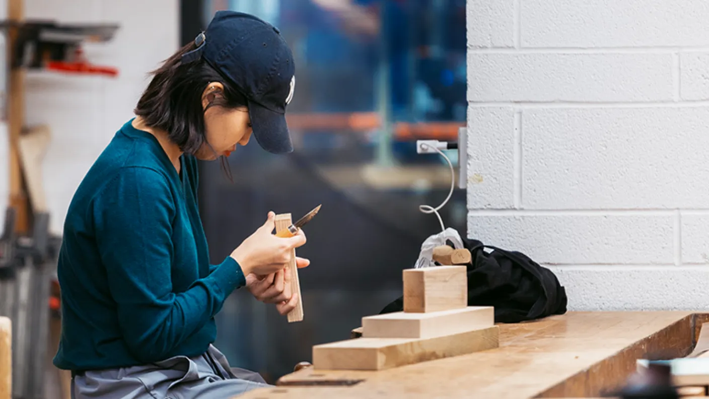Student working on a project in the woodshop