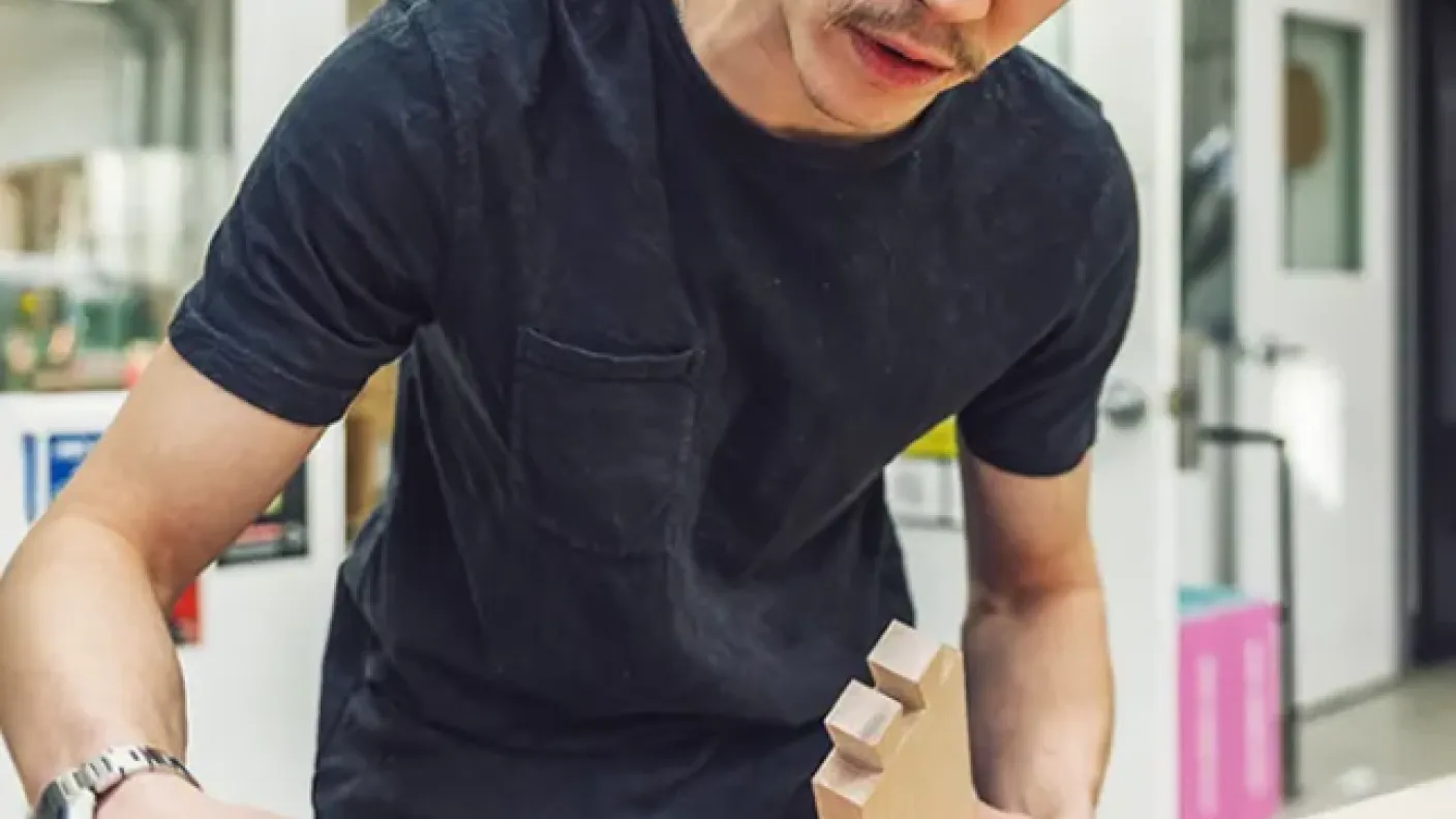 Student working at wood working table