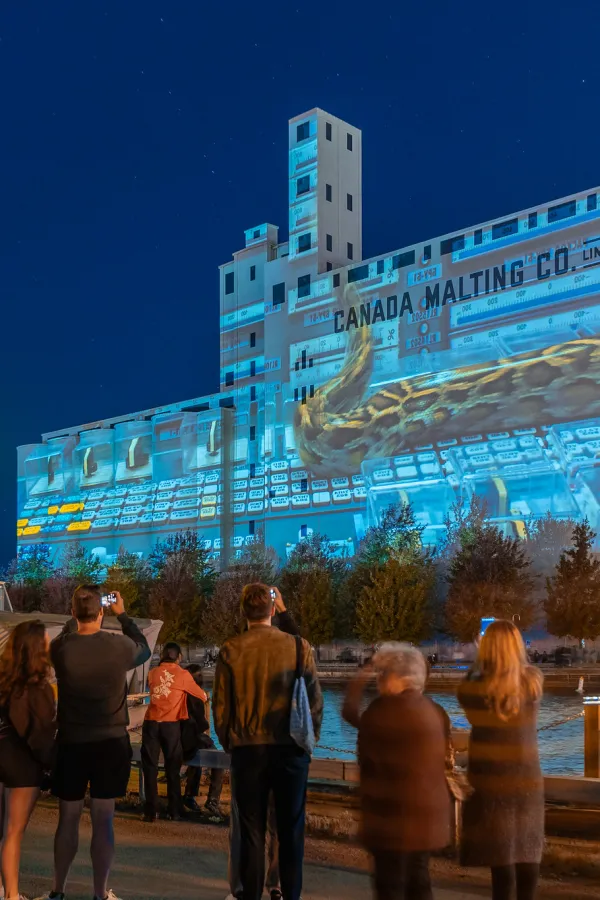 Projection on a large concrete building in the distance